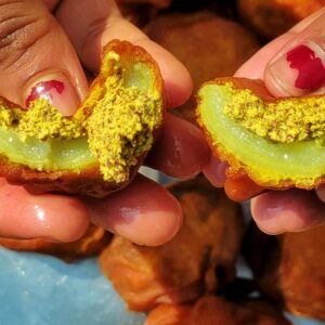 A crispy and golden brown sorisha kakrol (mustard stuffed bitter gourd fry)