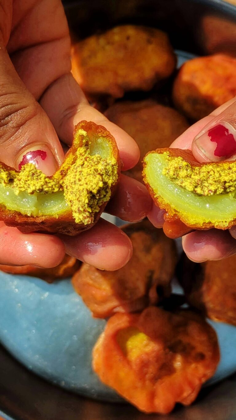A crispy and golden brown sorisha kakrol (mustard stuffed bitter gourd fry)